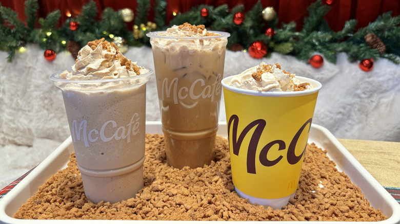 Three McDonald's cookie butter coffee drinks on tray with crushed cookies