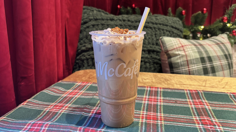 Large McDonald's Cookie Butter Iced Coffee on table with holiday decorations