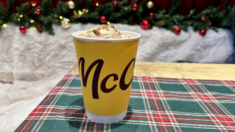 Medium McDonald's Cookie Butter Latte on table with holiday decorations