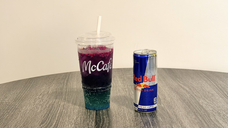 McDonald's Red Bull Dragonberry Energizer alongside a can of Red Bull