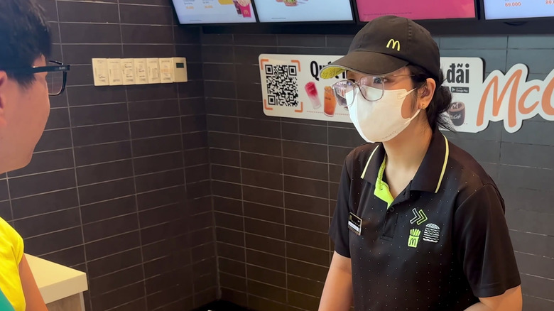 McDonald's cashier serving a person