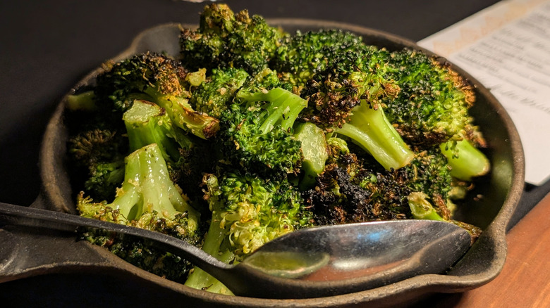A skillet of roasted broccoli
