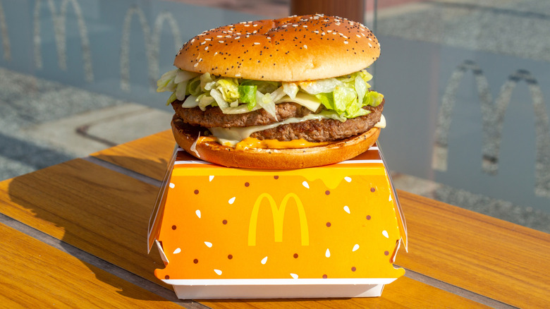 A McDonald's burger with a poppy and sesame seed bun