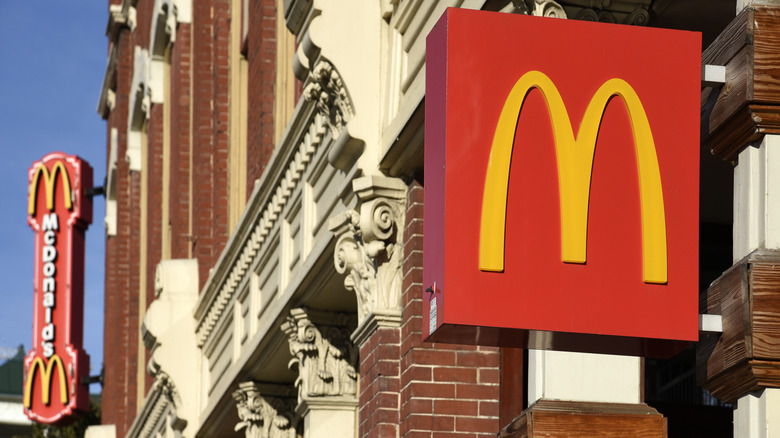 Two signs for McDonald's outside of a franchise location