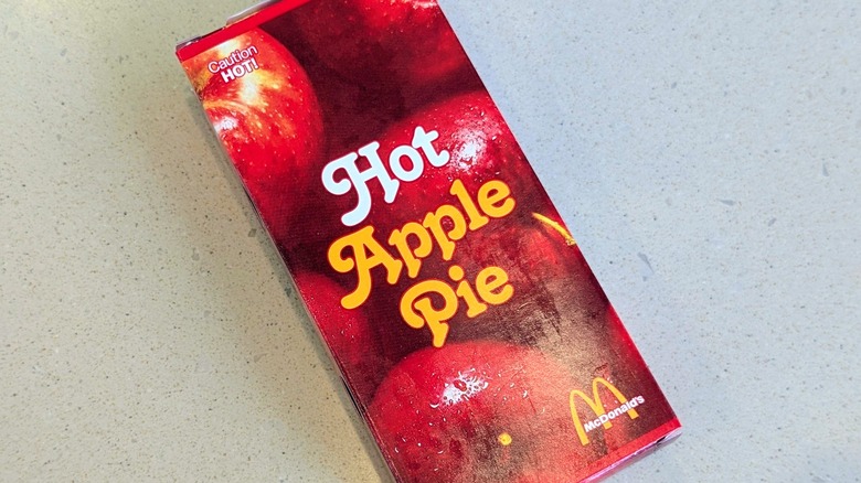 A McDonald's Fried Apple Pie box on a speckled table