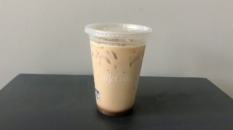 McDonald's iced pumpkin spice latte in a plastic cup