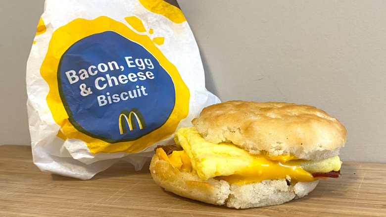 Bacon, Egg and Cheese Biscuit next to a McDonald's wrapper.