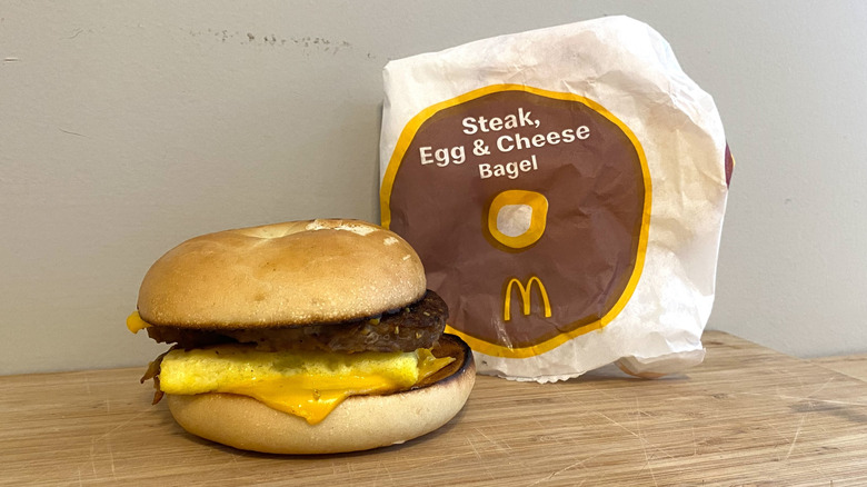 Steak, Egg and Cheese Bagel next to a McDonald's wrapper.