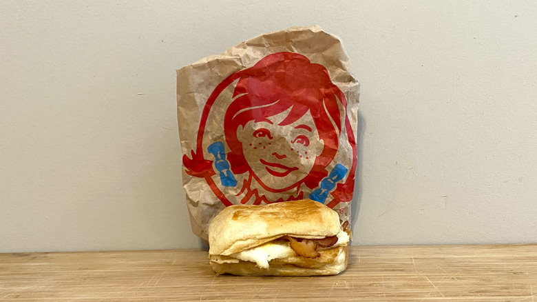 Bacon, Egg and Swiss Croissant in front of a Wendy's wrapper.