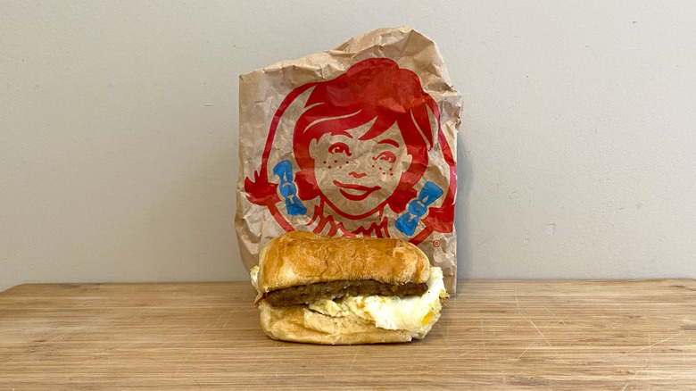 Sausage, Egg & Swiss Croissant in front of a Wendy's wrapper.