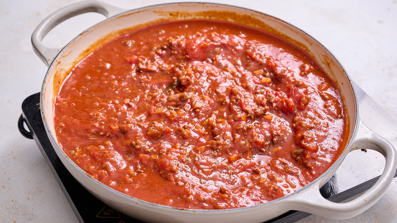 simmering pasta sauce in skillet