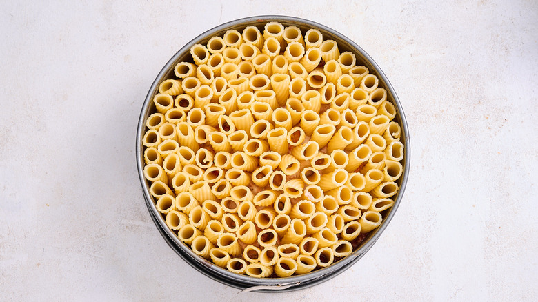 arranging the pasta in a springform pan
