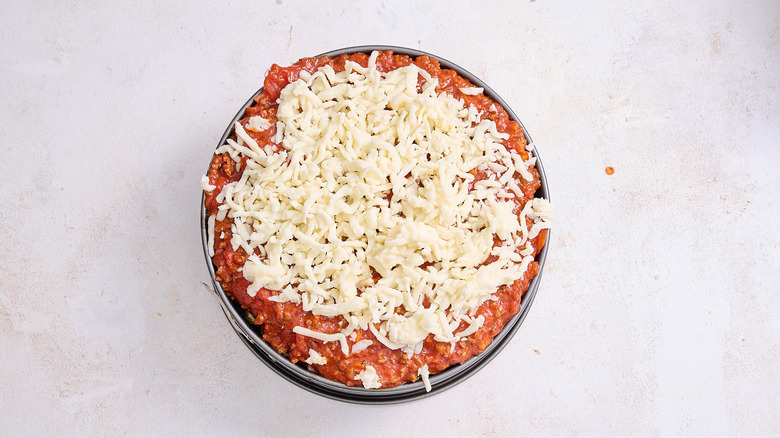 pasta and sauce topped with cheese