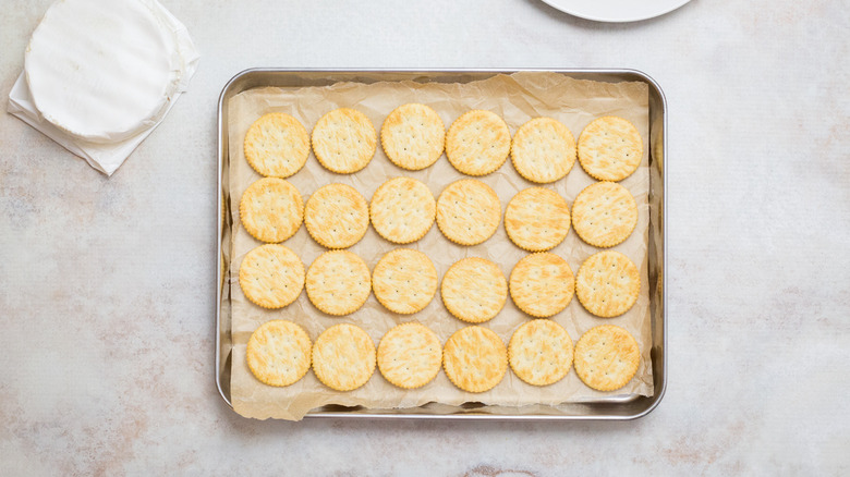 crackers on lined baking sheet
