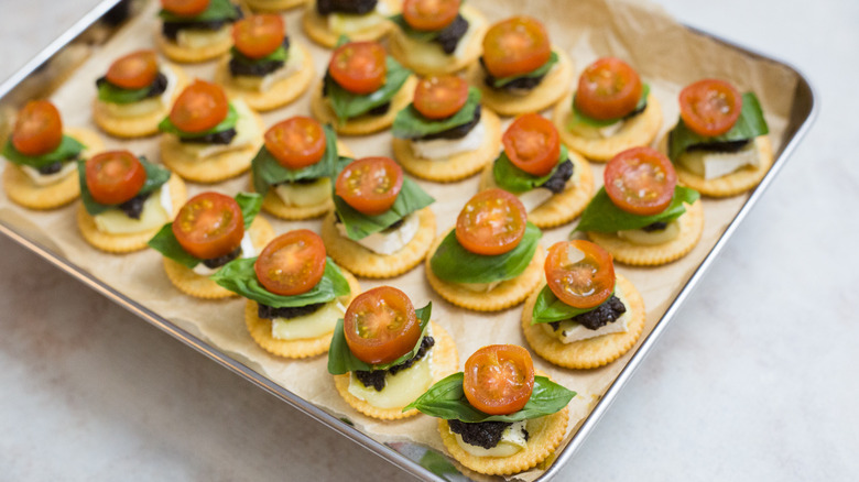 loaded crackers on baking sheet