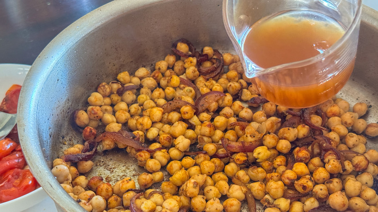 pouring broth into pan