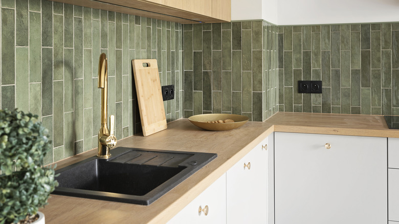 Kitchen interior with green backsplash