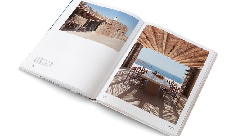 An open coffee table book featuring Mediterranean homes