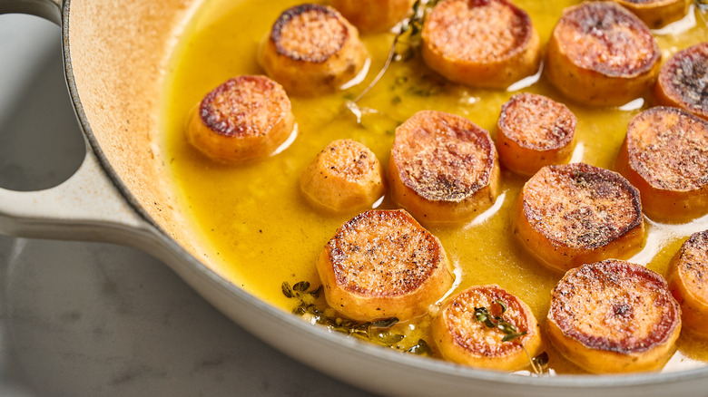 melting sweet potatoes in a pan