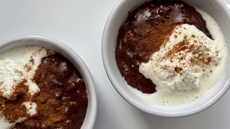 two bowls of mexican hot chocolate rice pudding with whipped cream