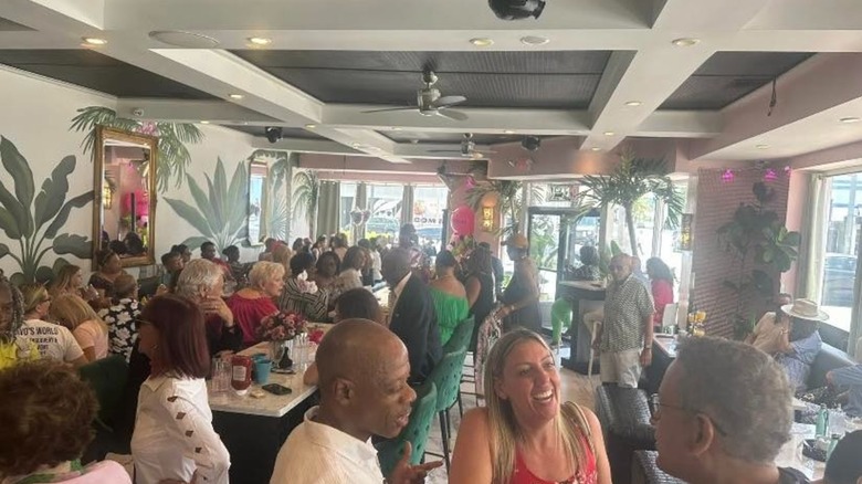 Customers eating and talking at Wanderlust Cafe & Lounge