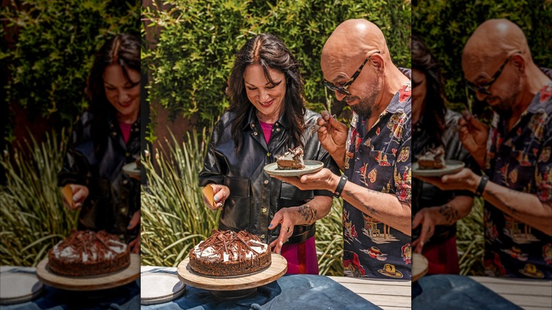 Chef Michael Symon and wife cutting into pie