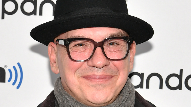 Michael Symon in glasses and hat