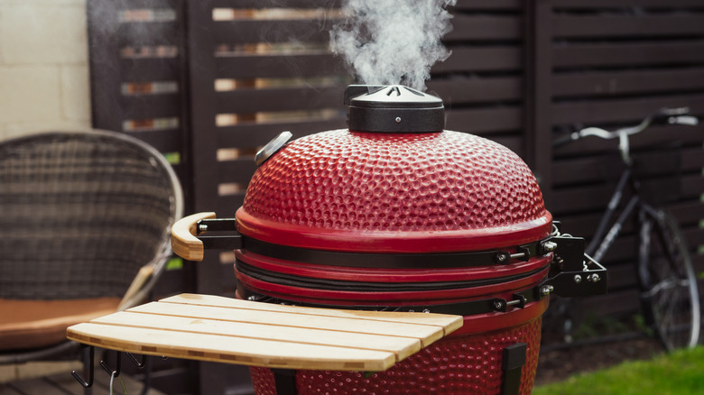 drum smoker in a backyard