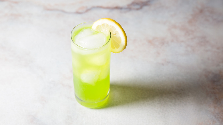Midori sour served on table