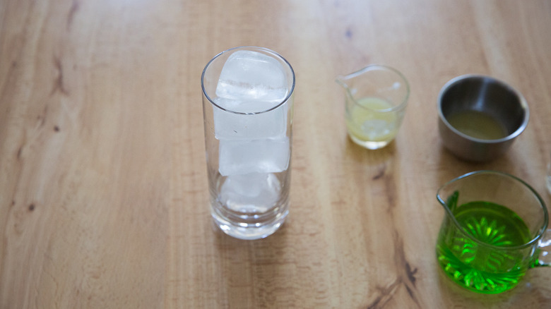 ice-filled Collins glass on table