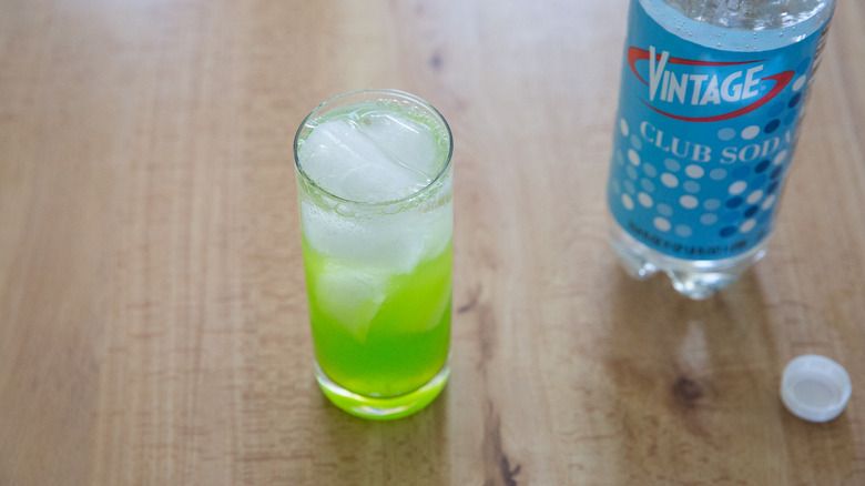 Midori sour on wooden table