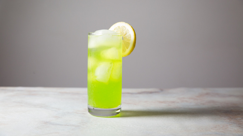 Midori sour served on table