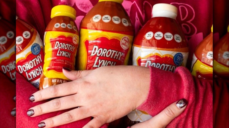 hands holding Dorothy Lynch dressing