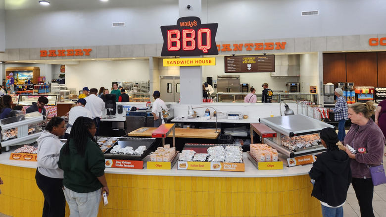 Customers at Wally's food station