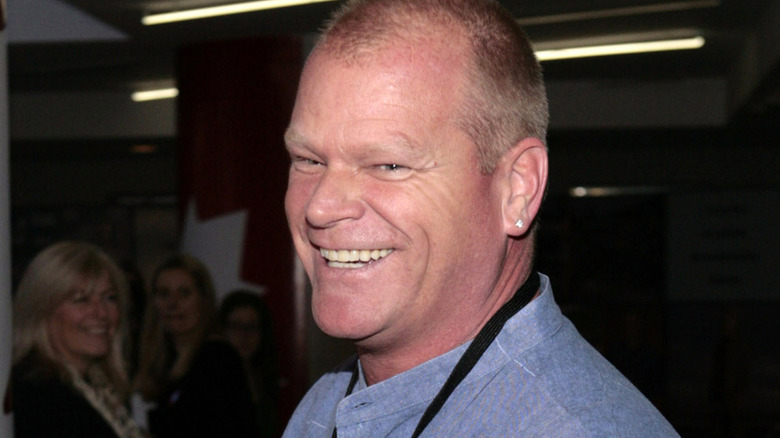 Mike Holmes smiling at an event