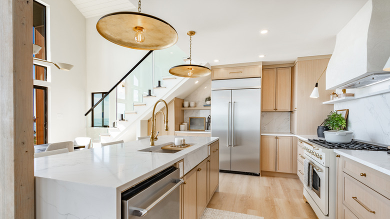 A kitchen with layered lighting