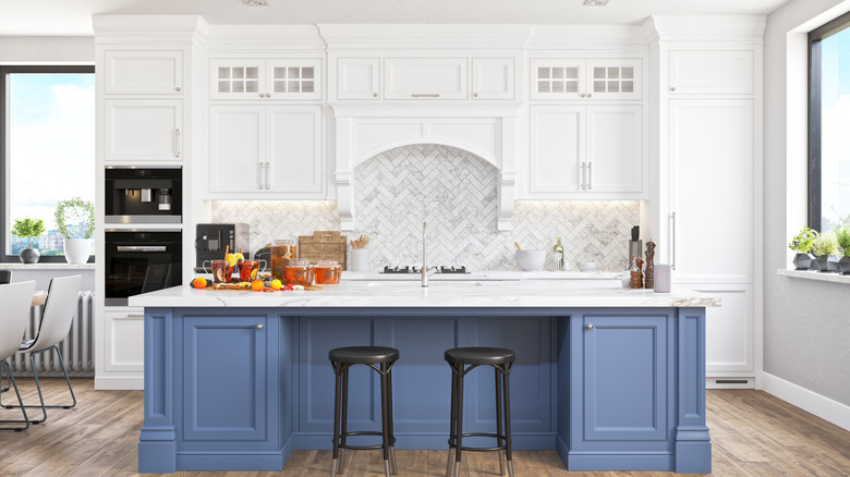 beautiful blue and white kitchen with custom cabinetry
