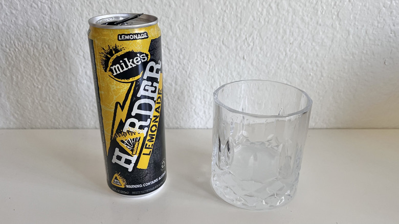 Harder Lemonade can on a table next to a glass