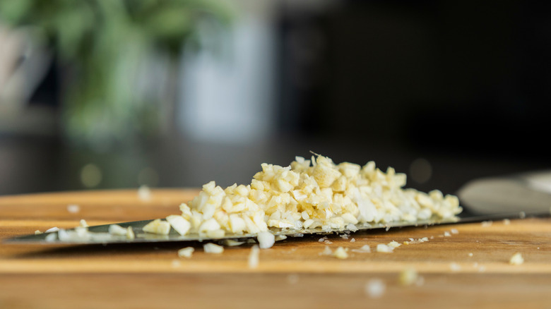 Minced garlic on a board
