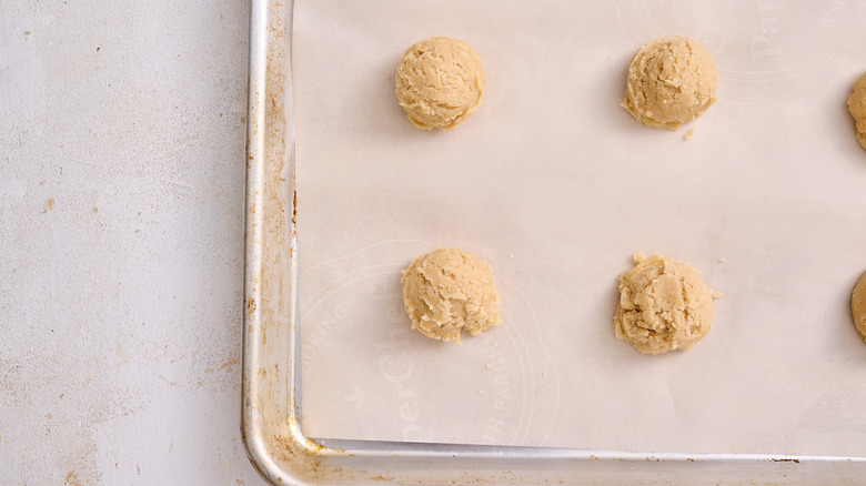 dough scooped onto a cookie sheet