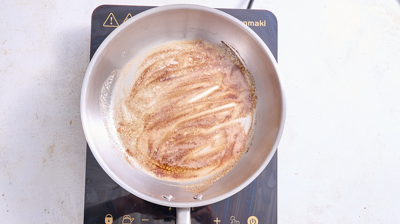cooking butter and cinnamon in a skillet
