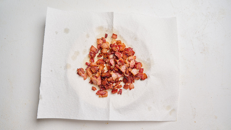 bacon pieces on a paper towel lined plate