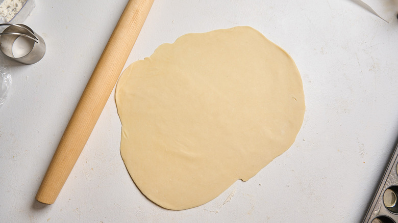 dough rolled out with a rolling pin