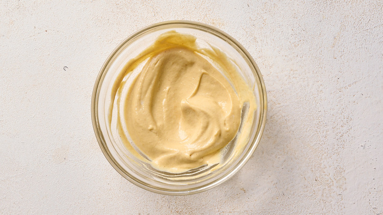 mayonnaise and mustard mixed in a bowl