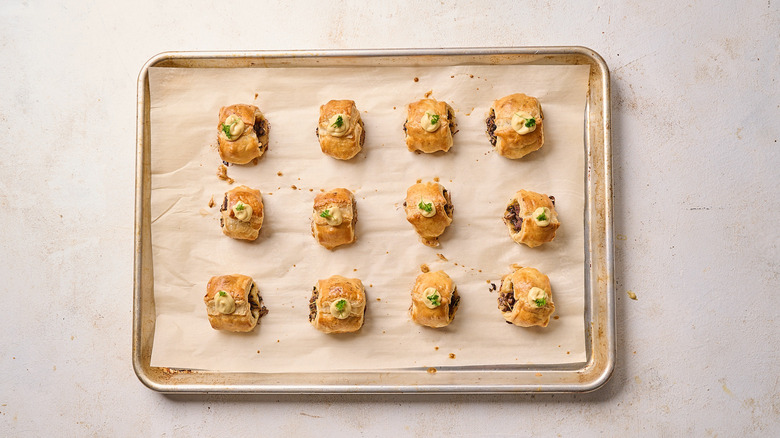 puff pastry bites garnished with mustard