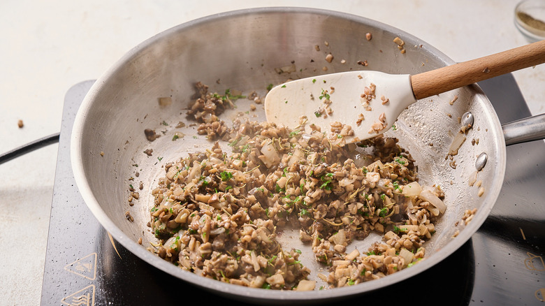 seasoning mushrooms with herbs