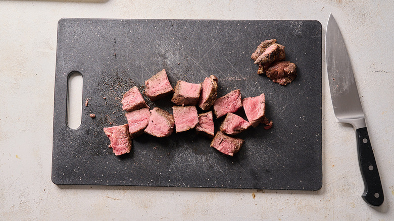 cutting meat into small pieces