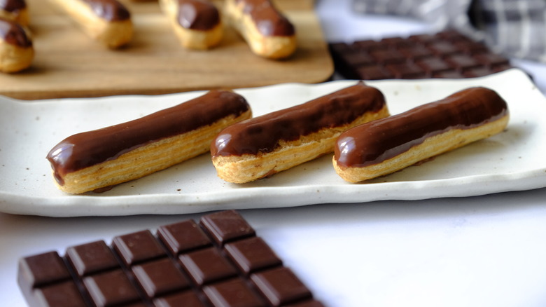 chocolate eclairs on a plate 