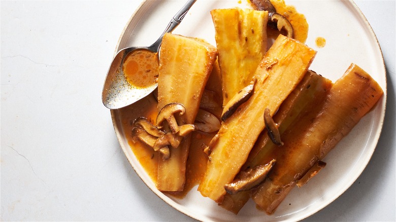 miso braised parsnips on a plate