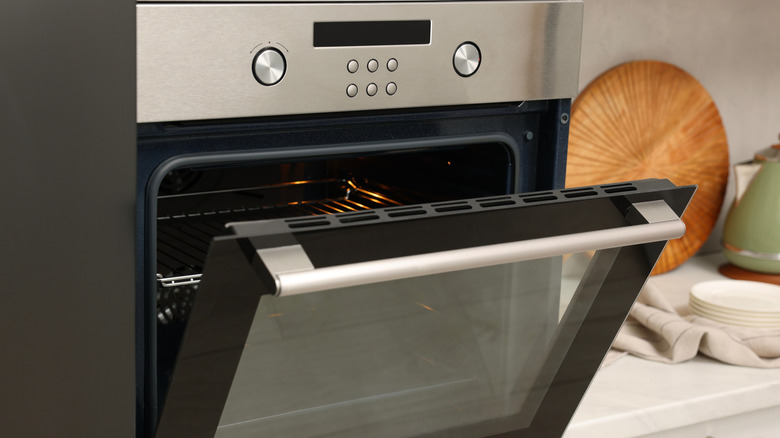 Open electric oven in kitchen
